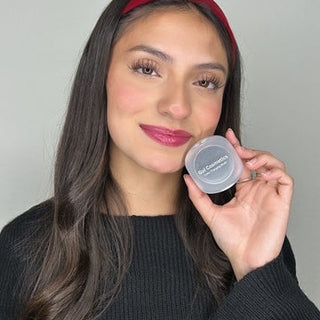 A model wearing the Color-Changing Blush, showcasing its ability to adapt to her skin tone, providing a natural pink or peach glow. 