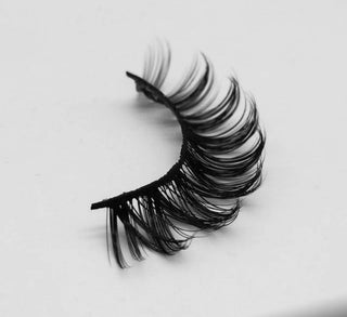 Showing the iconic Lashes style against a clean white background to emphasize their dramatic and luxurious look.