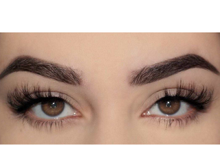 A close-up of a person’s eyes, showcasing Slay half lashes applied to the outer corners. The lashes create a fluttery, dramatic effect, enhancing the natural eye shape with a bold, lifted look.
