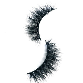 Showing off the so boujee lashes style in a white background
